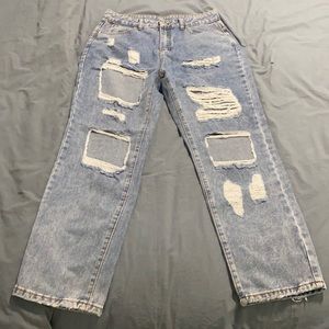 Ripped, high-waisted denim jeans